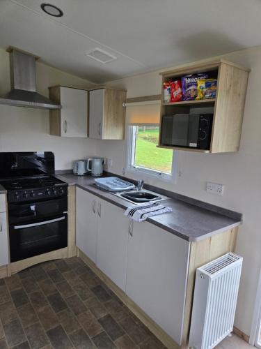 Η κουζίνα ή μικρή κουζίνα στο Ty-Dee Holiday Home inside Polperro Holiday