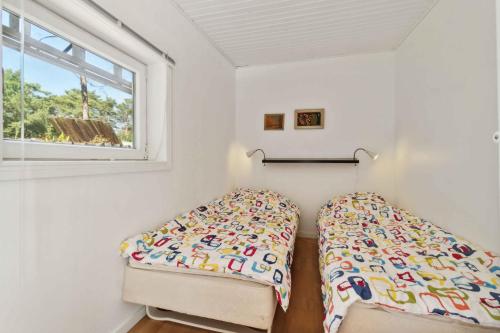 Ένα ή περισσότερα κρεβάτια σε δωμάτιο στο Lovely Summer House With Sauna And Terrace