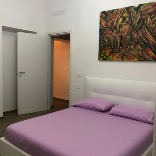 Postel nebo postele na pokoji v ubytování New Corso Italia Savona