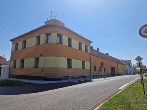 a large building on the side of a road at Ubytování Louny in Louny