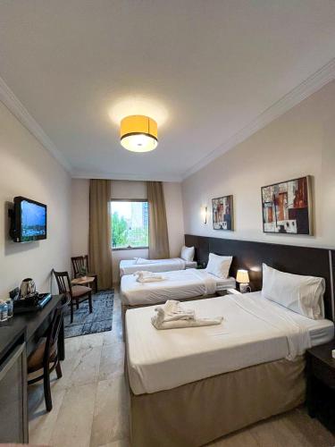 Postel nebo postele na pokoji v ubytování Hussein Hassan Ali Bayari Hotel