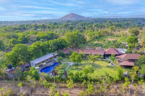 an aerial view of a house with a swimming pool at Taman Bidadari Eco Wellness in Pemuteran