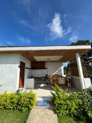 a patio with awning on top of a house at Kubah Bali Glamping in Kintamani