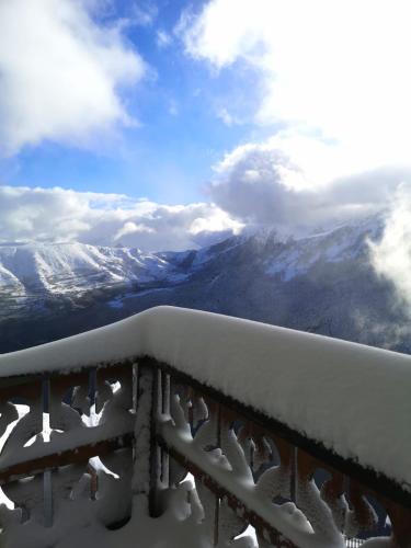 a view of snow covered mountains in the distance at Le Christiania in Saint-Lary-Soulan
