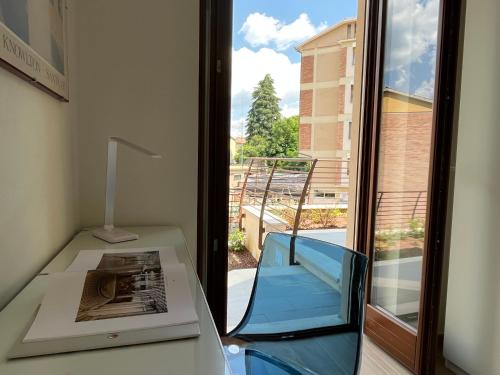 a view of a balcony from a room with a window at Sotto le Mura, appartamento Mosaico in Siena