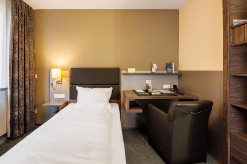 Un ou plusieurs lits dans un hébergement de l'établissement GenoHotel Forsbach