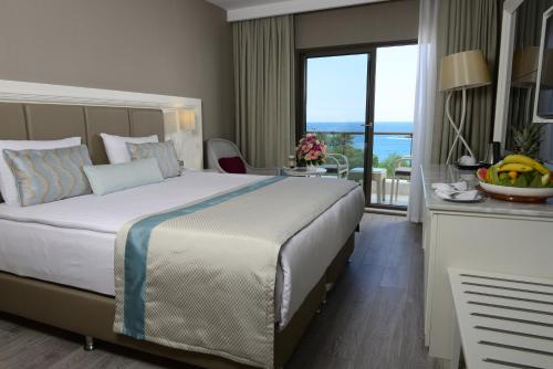 Ένα ή περισσότερα κρεβάτια σε δωμάτιο στο Wome Deluxe Hotel - Halal All Inclusive