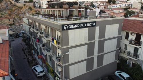a building with a sign that reads grand park hotel at Grand Faik Hotel in Cesme