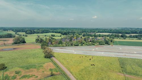 an aerial view of an airport with animals in a field at Romantik Studio - Cozy - Stylisch - Naturnah in Kempen