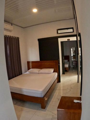 Ένα ή περισσότερα κρεβάτια σε δωμάτιο στο Rullah Homestay