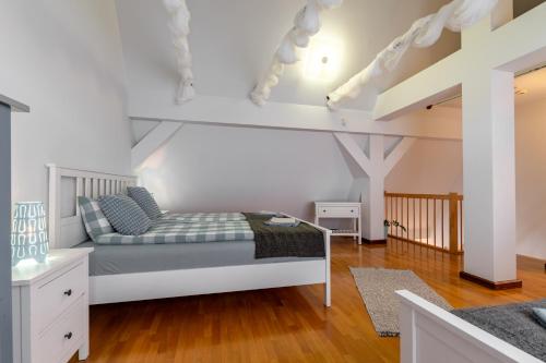 Posteľ alebo postele v izbe v ubytovaní Apartementy Plac Solny 20