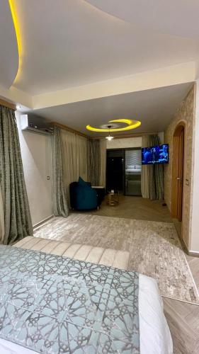 a bedroom with a bed and a living room at Oasis TIFNIT Villa with Pool View No vis A vis in Draïd