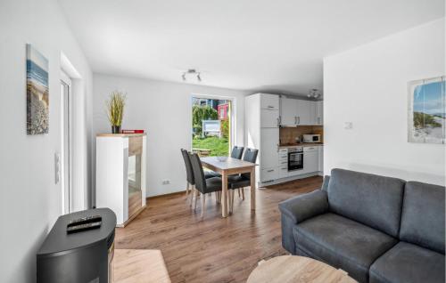 a living room with a couch and a table at Seehund Xl in Süssau