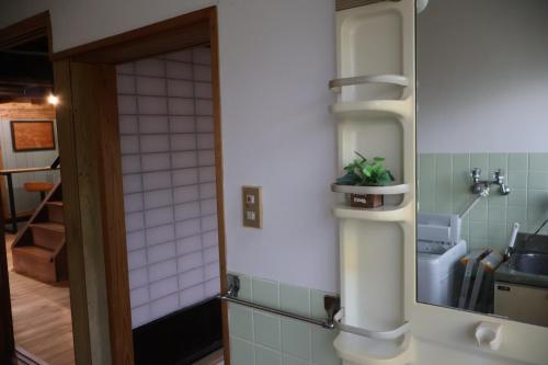 Koupelna v ubytování Guest House Kurukuru ゲストハウスくるくる
