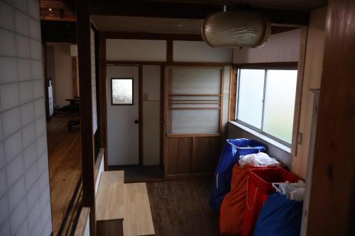Guest House Kurukuru ゲストハウスくるくるにあるベッド