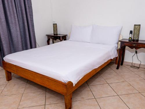 Postel nebo postele na pokoji v ubytování Bottle Palm Villa