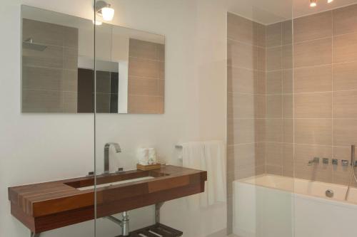 a bathroom with a sink and a shower at The Ocean Club, a Luxury Collection Resort, Costa Norte in Sosúa