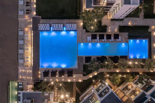 an overhead view of a swimming pool at night at The Ocean Club, a Luxury Collection Resort, Costa Norte in Sosúa