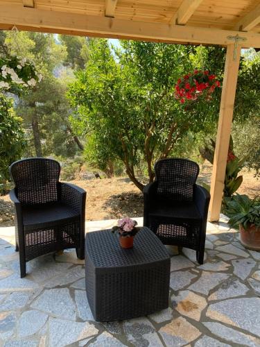 two chairs and a table on a patio at Rama Guest House in Berat