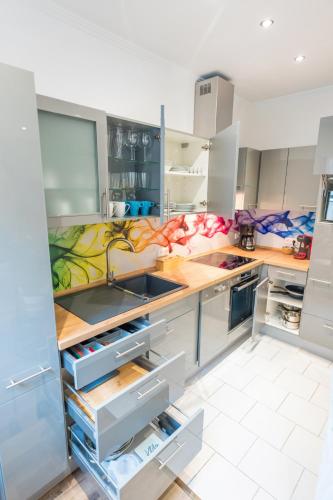 a kitchen with a sink and a counter at Stylisch - ruhig - gemütlich - zentral - einladend in Krefeld