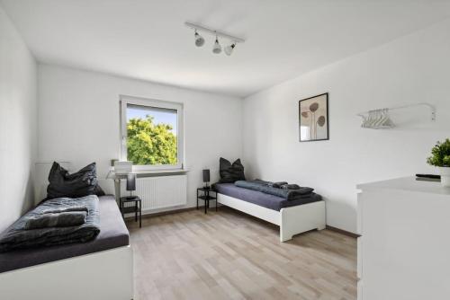 Postel nebo postele na pokoji v ubytování BIR01 Work & Stay in Rüsselsheim