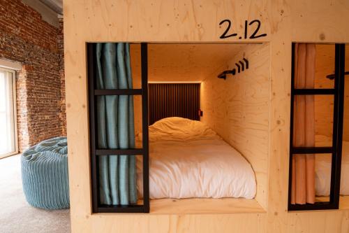 Postel nebo postele na pokoji v ubytování PJs Hostel