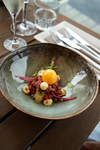 a plate of food with an egg on a table at Schippershuis Terherne in Terherne