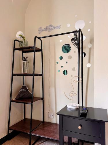 a dressing room with a mirror and a table at INNit Bloom - Triple Studio in Brighton & Hove