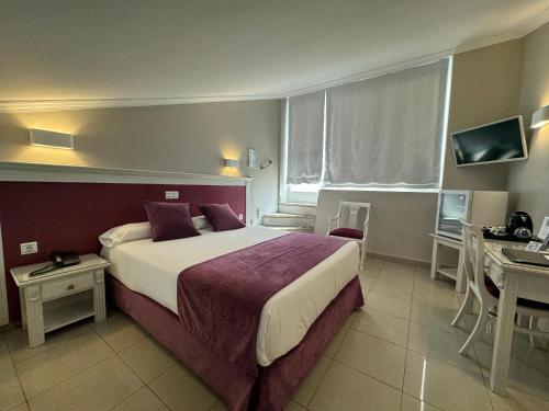 Ένα ή περισσότερα κρεβάτια σε δωμάτιο στο Hotel Plaza Cavana
