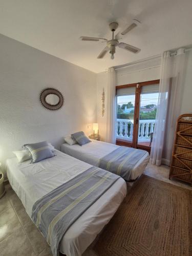 En eller flere senge i et værelse på Casa Buganvilla