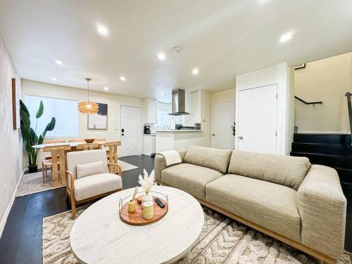 a living room with a couch and a table at Bohemian Dream- 2BR, Retreat Near Hollywood -BR6 in Los Angeles