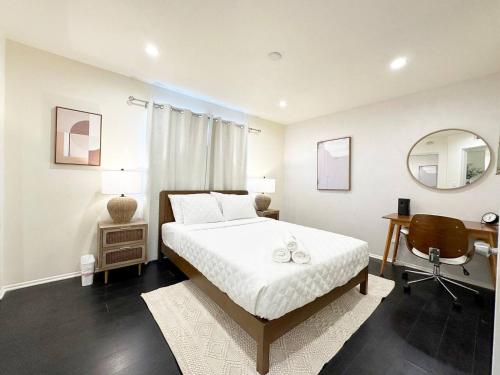 a bedroom with a bed and a desk and a chair at Bohemian Dream- 2BR, Retreat Near Hollywood -BR6 in Los Angeles