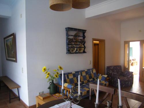 a living room with a couch and a table at Quinta De Azemeis in Vimieiro