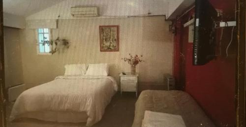 Ένα ή περισσότερα κρεβάτια σε δωμάτιο στο Habitación privada Barrio Uno