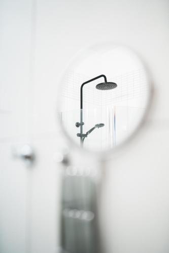 a bathroom with a sink and a mirror at Aroma Stone Hotel Spa in Syców