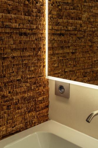 a bathroom with a mirror and a sink at La Forestale Luxury Ecolodge B&B Primo Piano in Acqualagna