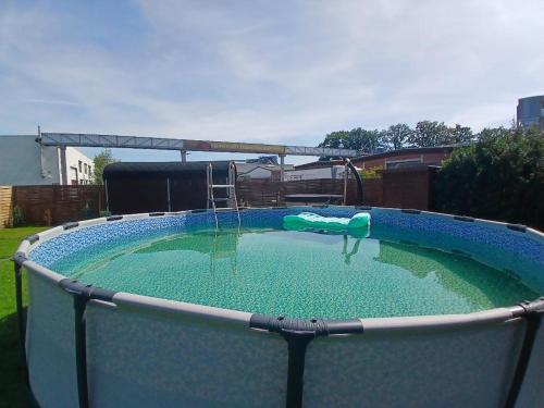 a large pool of water with a swing at Hani's Partyhaus in Verl