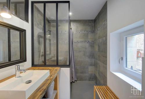 a bathroom with a sink and a shower at Azalée - Azay sur Cher in Azay-sur-Cher