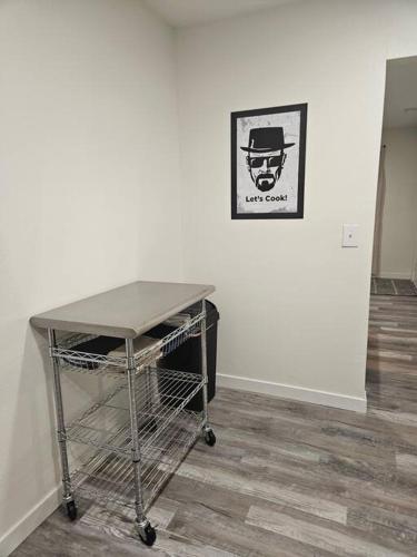a shopping cart sitting in front of a white wall at Madrona's Cottage A in Charleston