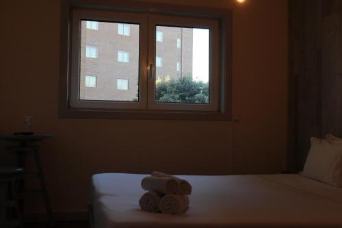 Ένα ή περισσότερα κρεβάτια σε δωμάτιο στο Oportocean Suites