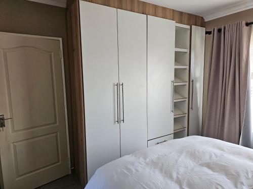 Katil atau katil-katil dalam bilik di Prime Nest Guest Apartments