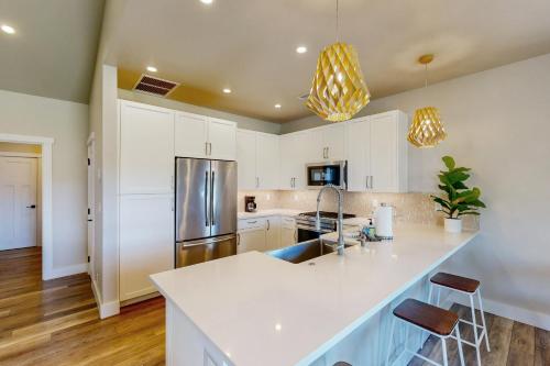 a kitchen with white cabinets and a white counter top at Waikoloa in Waikoloa
