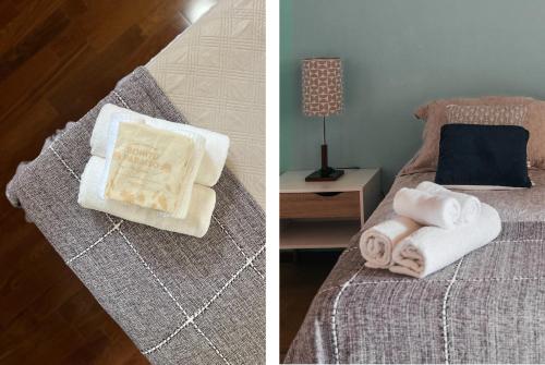a bedroom with a bed with towels and a lamp at Bonito Paraiso Ilha Grande in Abraão