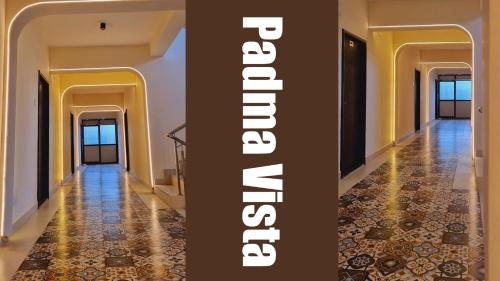 a hallway of a building with a tile floor at Hotel Padma Vista Nellore Near Bus Stop in Nellore