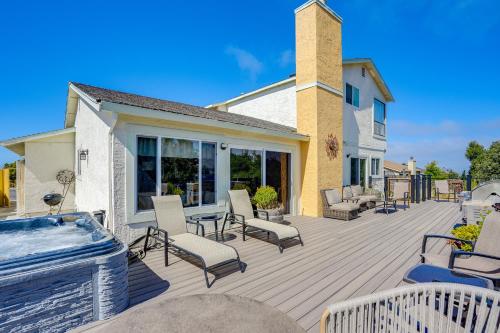 a large deck with chairs and a hot tub at Vallejo Home with Spacious Deck, Hot Tub and Views in Vallejo