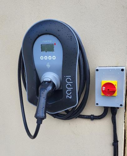 a black electrical device is attached to a wall at Brook Manor Lodge in Tralee