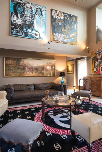 a living room with a couch and a table at Sunset Villa in Castiglione della Pescaia