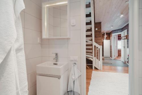 a bathroom with a toilet and a sink at Trillevallens Högfjällshotell & Lägenheter in Trillevallen