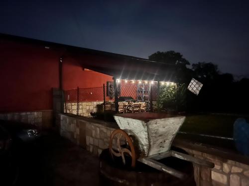 a table with lights on top of a building at night at B&B Colle Cucchiara in Cassino