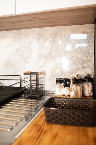 a kitchen with a counter top with pots and pans at Eka's Village in Plav